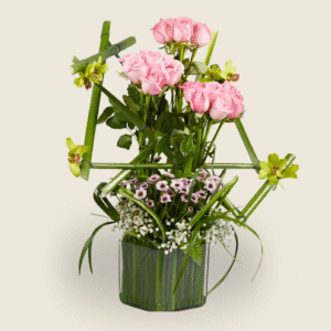 Modern square vase arrangement with pink roses and green orchids