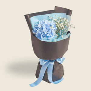 Fresh blue hydrangea bouquet with gypsophila and blue ribbon