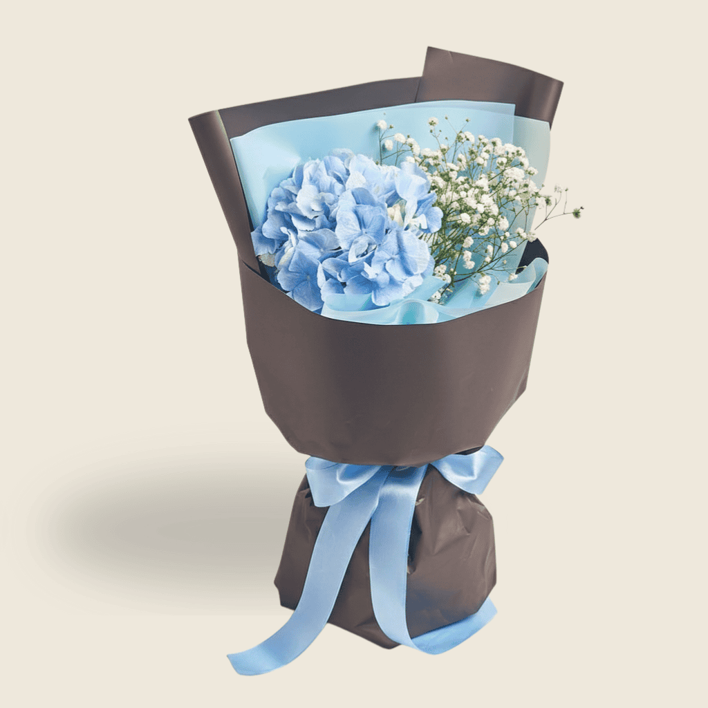 Fresh blue hydrangea bouquet with gypsophila and blue ribbon