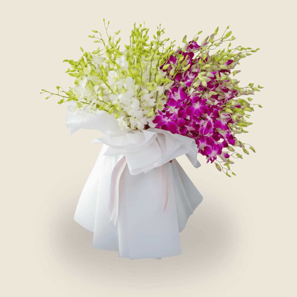 Luxurious white and purple orchid bouquet wrapped in white paper