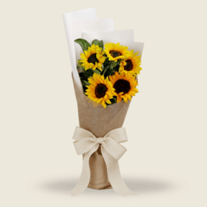Cheerful sunflower bouquet wrapped in jute with a white ribbon