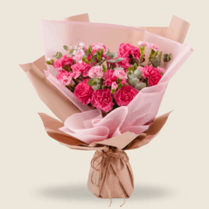 Charming bouquet of pink carnations in rustic wrap
