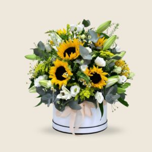 Sunflower and white lily round hatbox arrangement